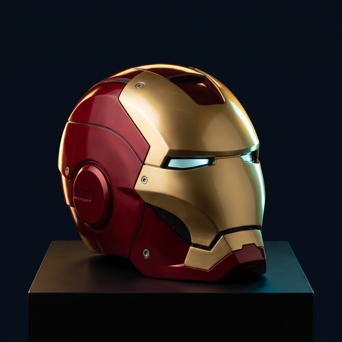 Solis Aegis MK-V collector helmet in red and gold on a black display plinth with illuminated eye slits