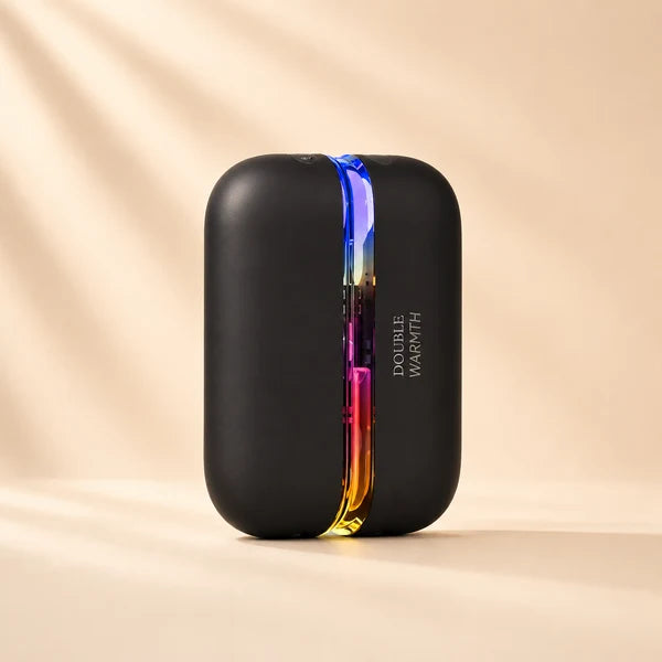 Solis Ember twin hand warmers in the Black colourway, closed, with the seam lit through the full colour range
