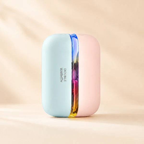 Solis Ember twin hand warmers in the Blue Pink colourway, the pale blue and pink halves standing together