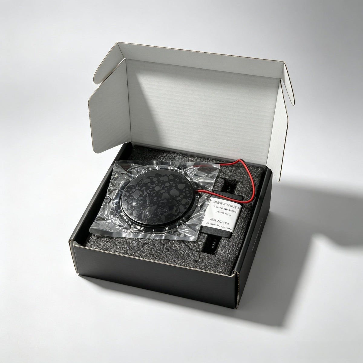 What is in the box: the sealed emblem, the wiring harness and its small control module