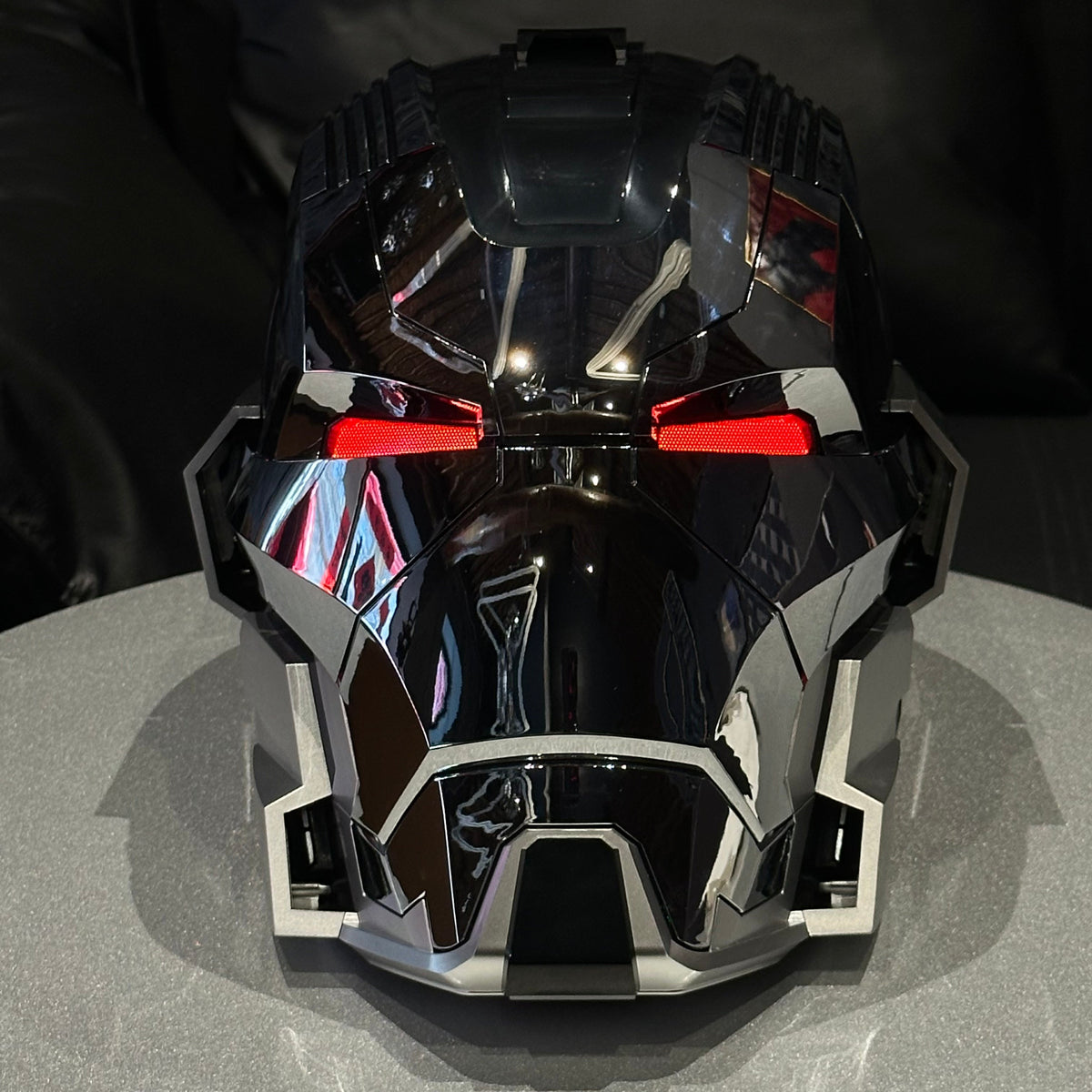 Solis Aegis MK-XVII helmet in Silver & Black — front view on a stand