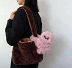 Solis Bag Charm — pink, carried at the hip