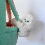 Solis Bag Charm — ivory, hooked over a mint tote