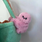 Solis Bag Charm — pink, hooked over a mint tote