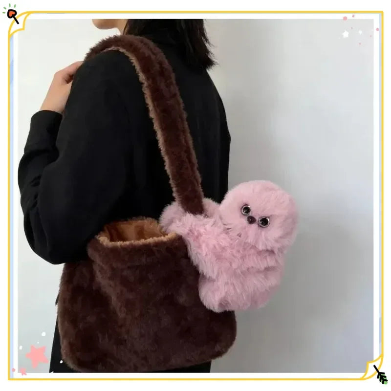Solis Bag Charm — pink, on a brown shoulder bag