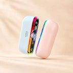 Solis Ember twin hand warmers split into its two halves, one pale blue with the lit control screen and one pink