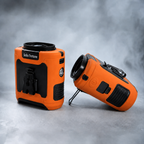 Solis Breeze waist fan in orange, showing the belt clip on the upright unit and the fan intake on the other