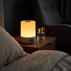 The Solis Horae lit on a bedside table in a dark bedroom
