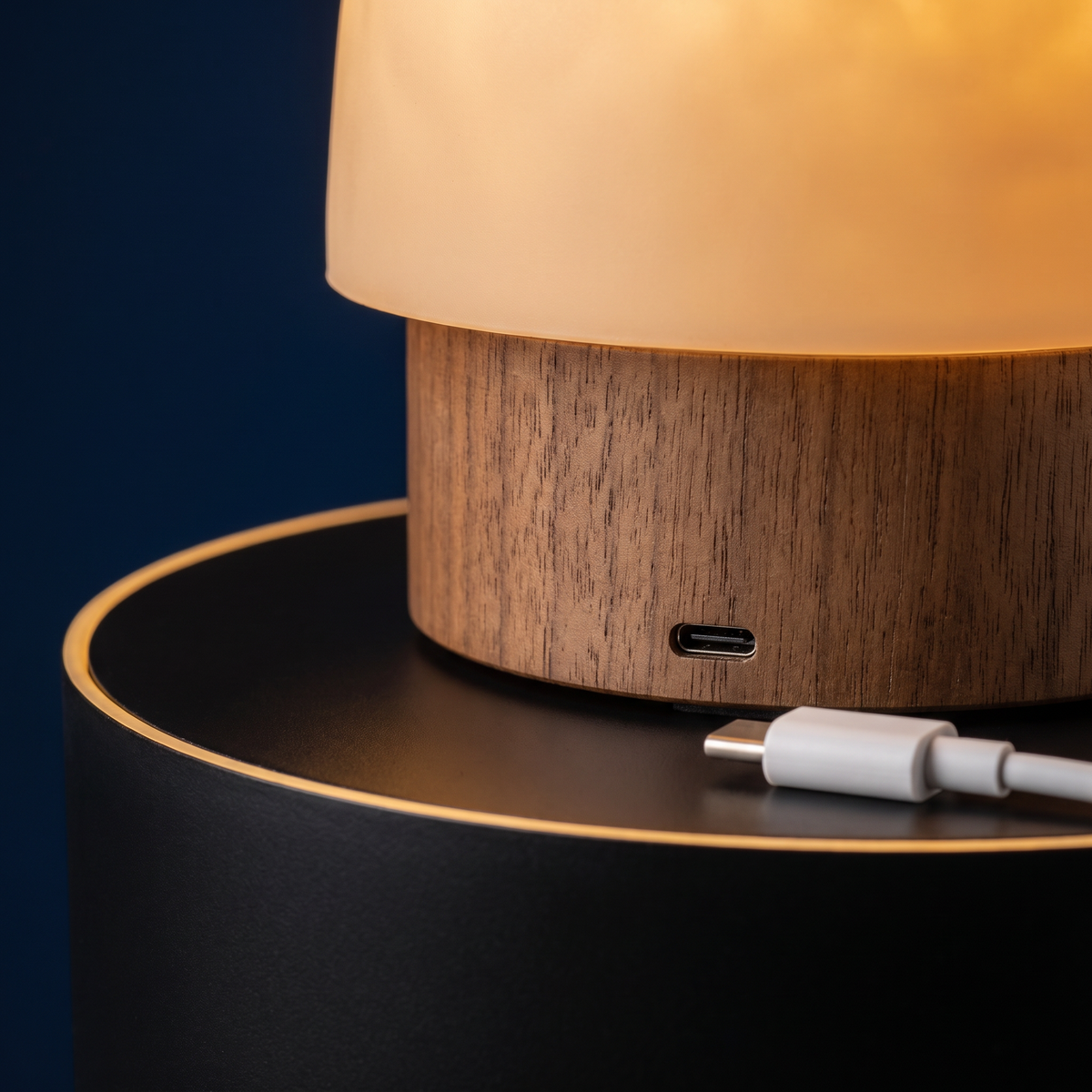 Close detail of the Solis Lumen's weighted base, touch control and USB-C port