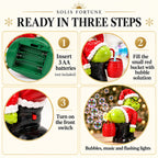Grinch bubble machine — Christmas bubble machine setup: 3 AA batteries, fill the red bucket, front switch, Solis Jingle Bum