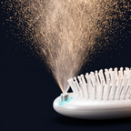 Solis Mist Hydrating Hair Brush — Macro of the mist nozzle mid-spray