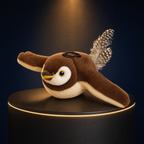 The Solis Wren plush cat toy bird with its wings raised mid-flap, on a lit black podium