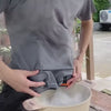 Solis Breeze waist fan clipped to a belt, running