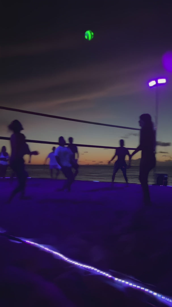 Solis Nightfall Glow-in-the-Dark Volleyball in use after dark