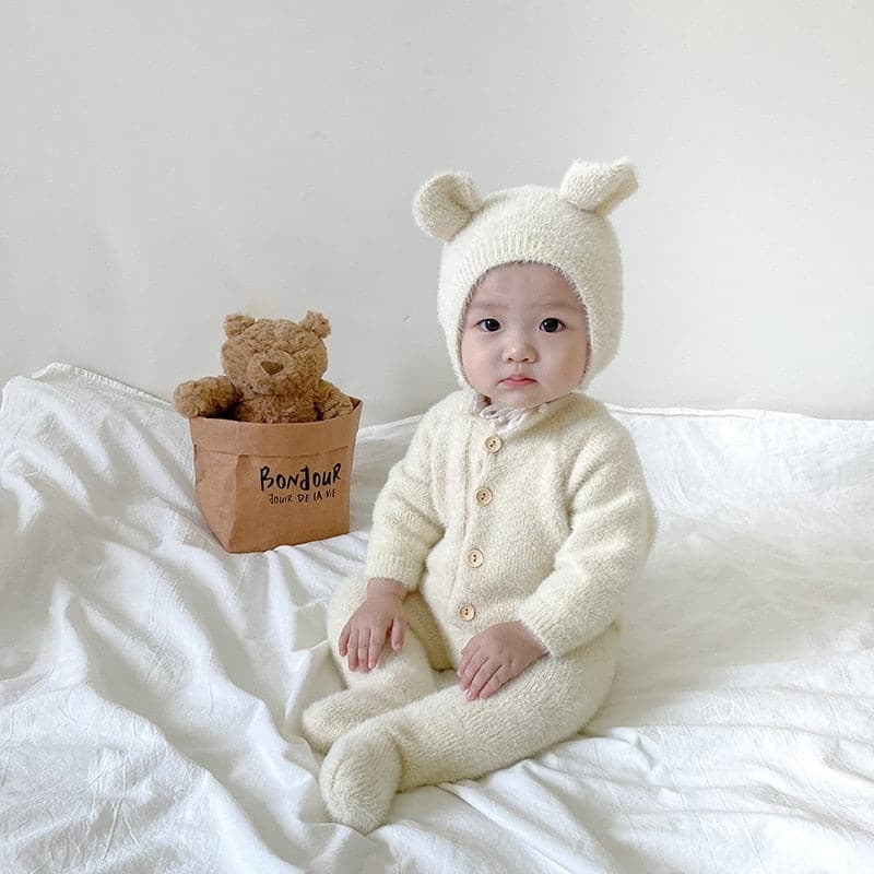 Solis Bear Cub Romper — White: fuzzy footed romper with bear-ear bonnet