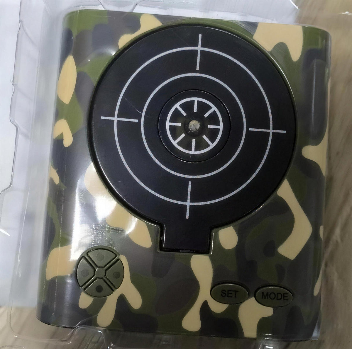 Solis Bullseye — bullseye target folded down on top of the camo alarm clock