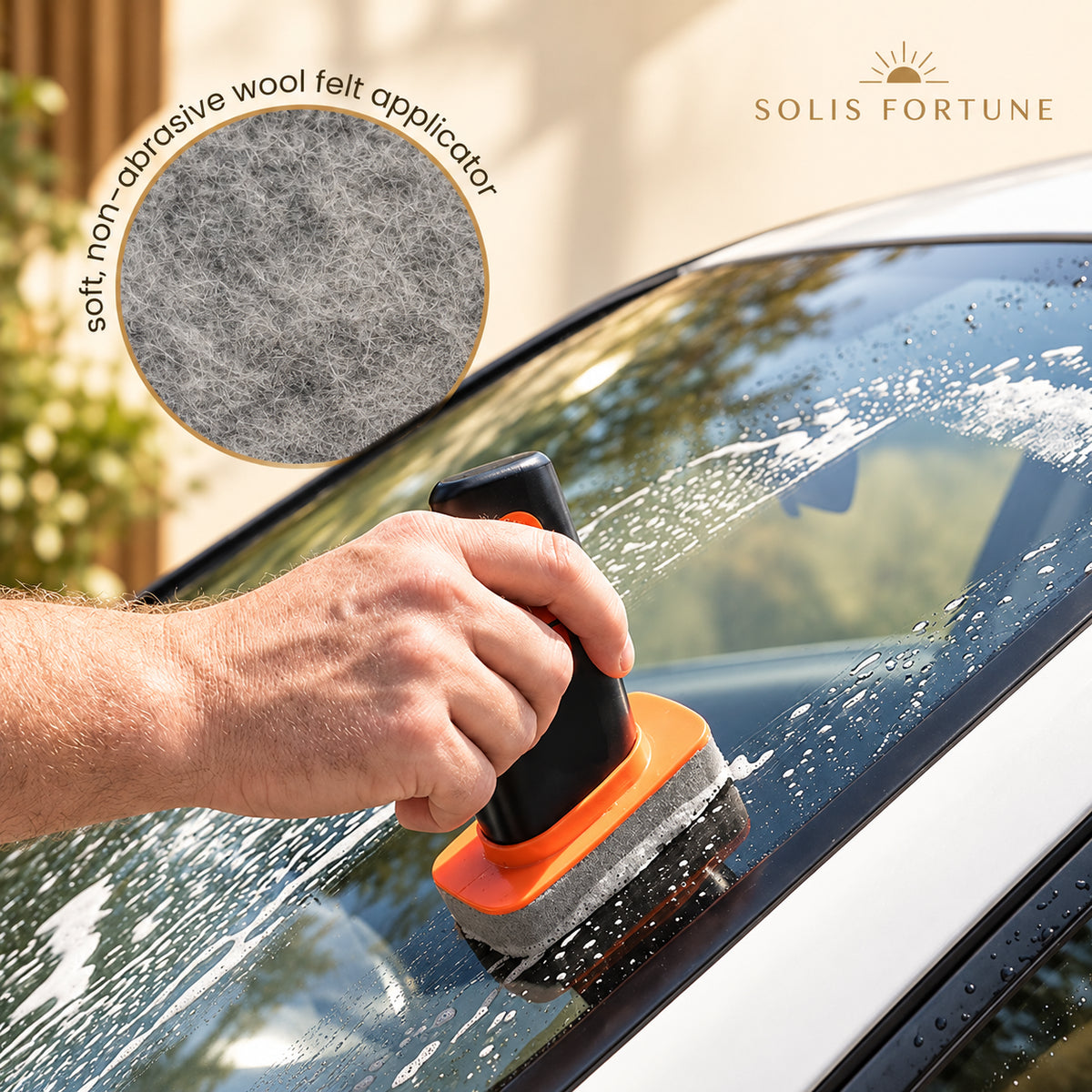 Solis Clearpass — soft non-abrasive wool felt applicator on a windshield