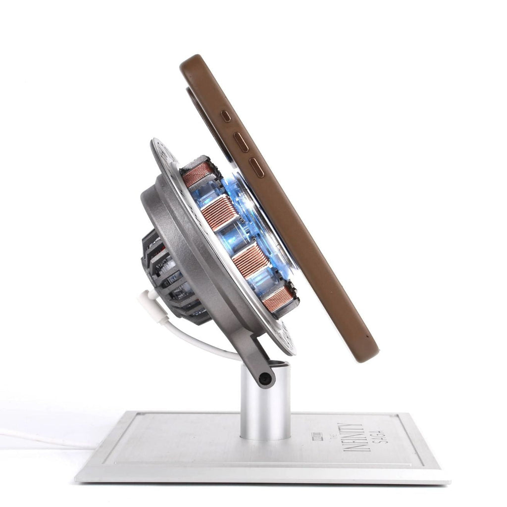 A phone resting against the Solis Core Reactor while it charges wirelessly