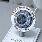 Close-up of the engraved ring, copper-toned coils and glowing core of the arc reactor charger