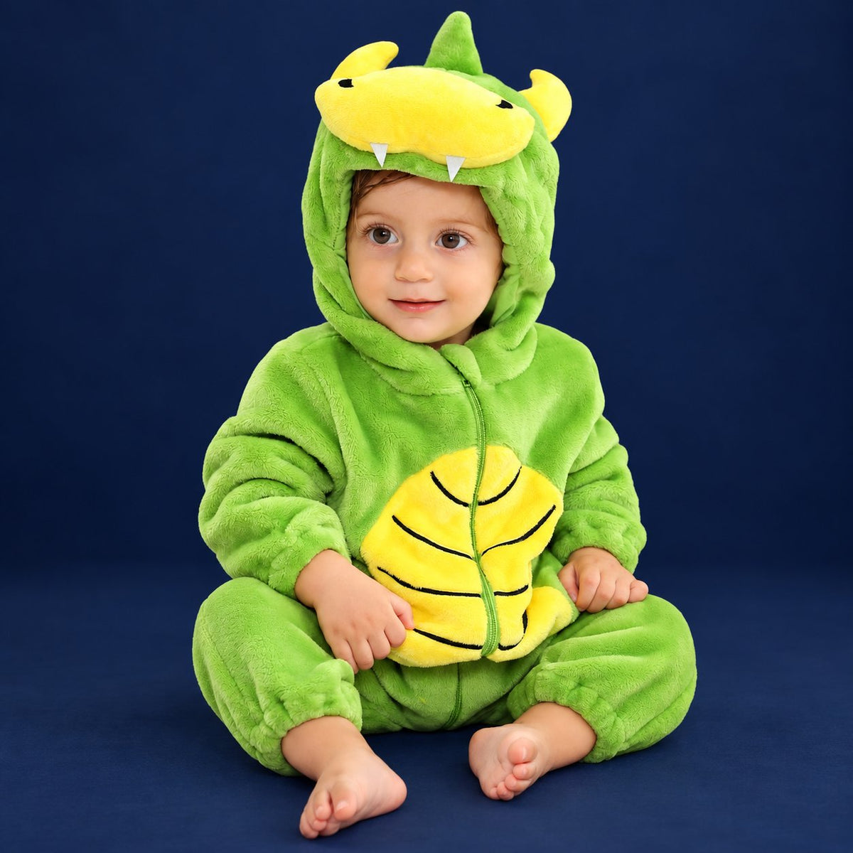 Solis Critter Onesie — Green Dino: flannel hooded animal romper worn by a baby