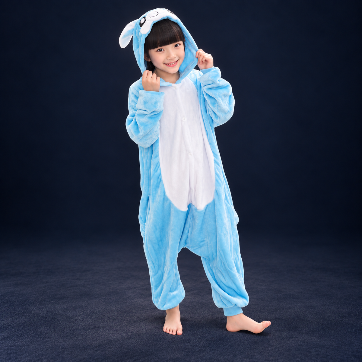 solis critter onesie kids 3d blue bunny — 3D Blue Bunny worn by a child on a dark navy studio background