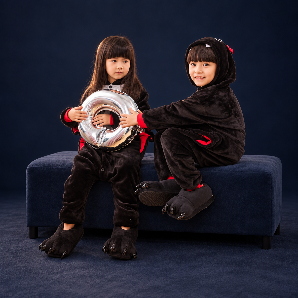 solis critter onesie kids bat — Bat worn by a child on a dark navy studio background