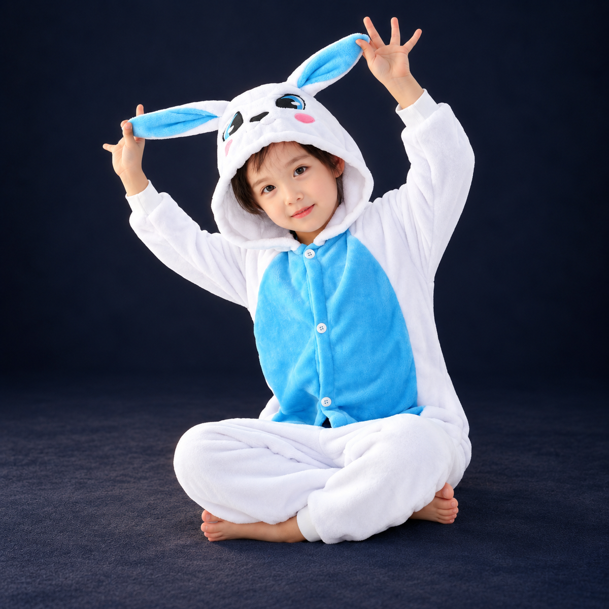 solis critter onesie kids blue bunny — Blue Bunny worn by a child on a dark navy studio background