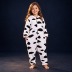 solis critter onesie kids cow — Cow worn by a child on a dark navy studio background