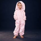 solis critter onesie kids gold bunny — Gold Bunny worn by a child on a dark navy studio background