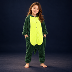 solis critter onesie kids green dino — Green Dino worn by a child on a dark navy studio background