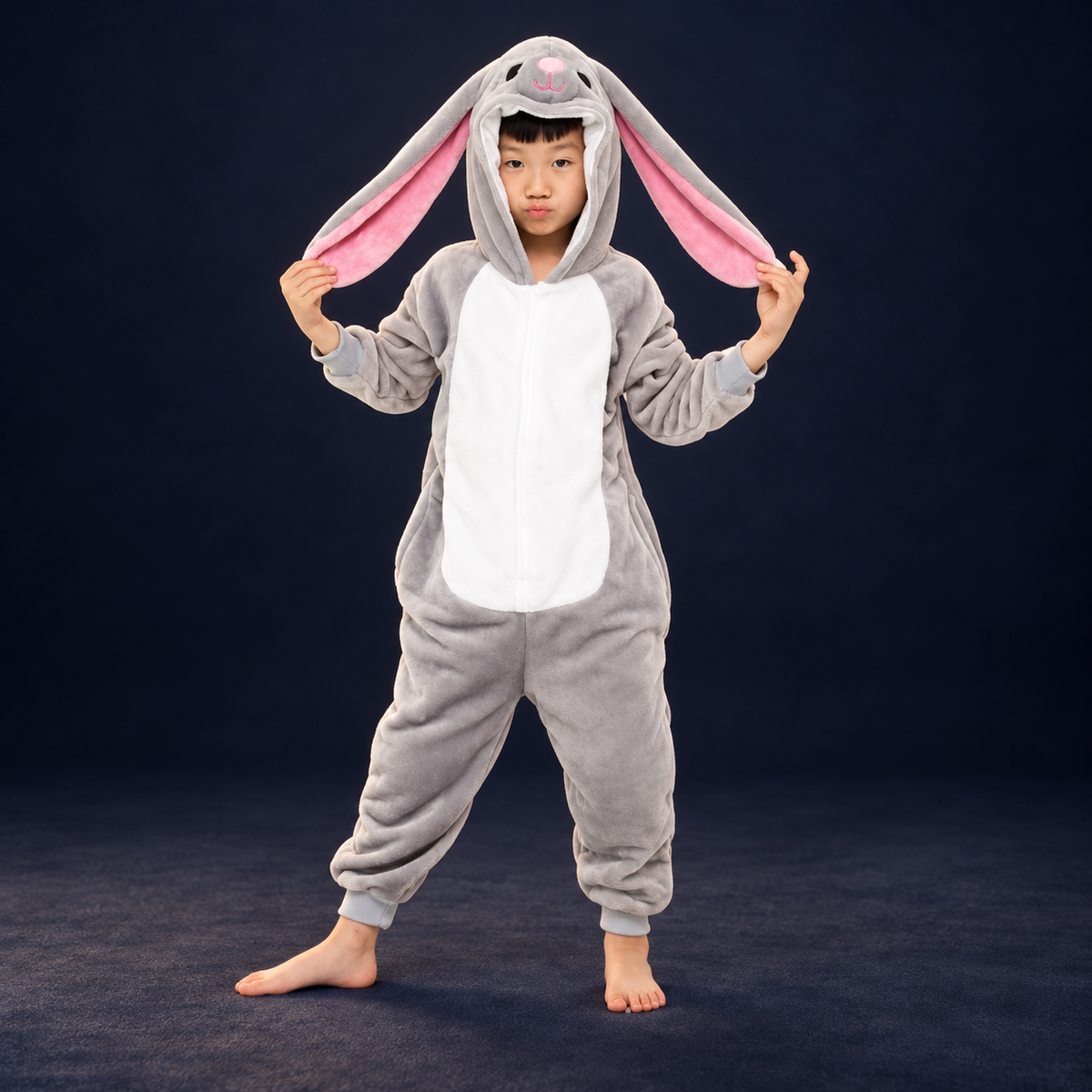 solis critter onesie kids grey hare — Grey Hare worn by a child on a dark navy studio background