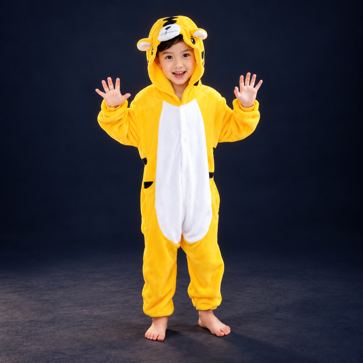 solis critter onesie kids yellow tiger — Yellow Tiger worn by a child on a dark navy studio background