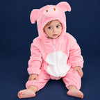 Solis Critter Onesie — Pink Pig: flannel hooded animal romper worn by a baby