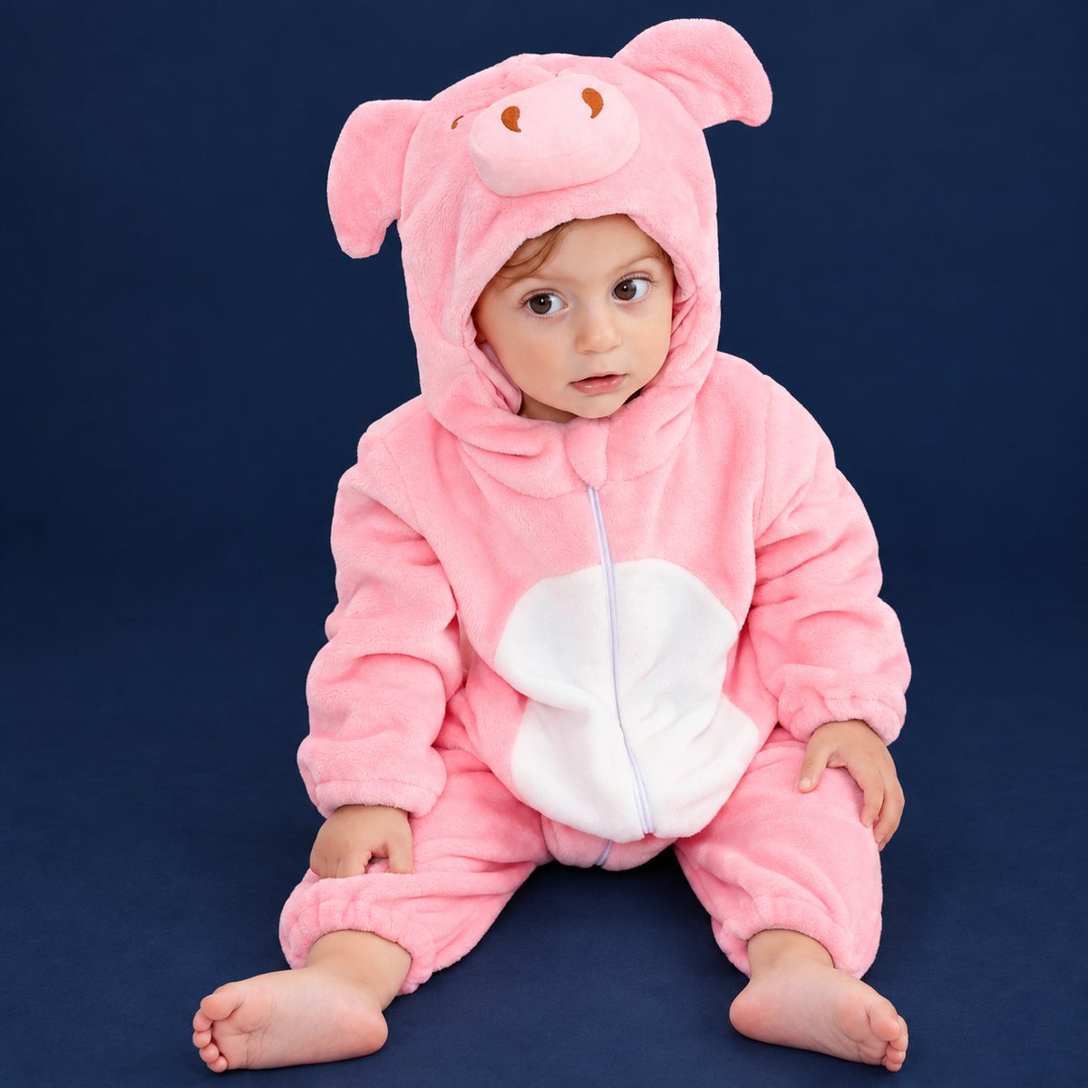 Solis Critter Onesie — Pink Pig: flannel hooded animal romper worn by a baby