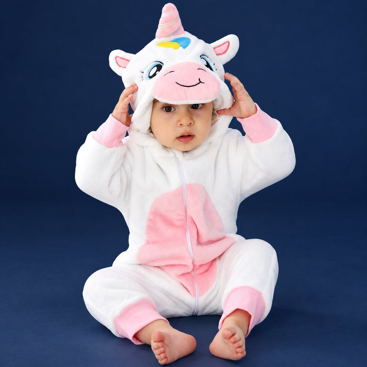 Solis Critter Onesie — White Unicorn: flannel hooded animal romper worn by a baby