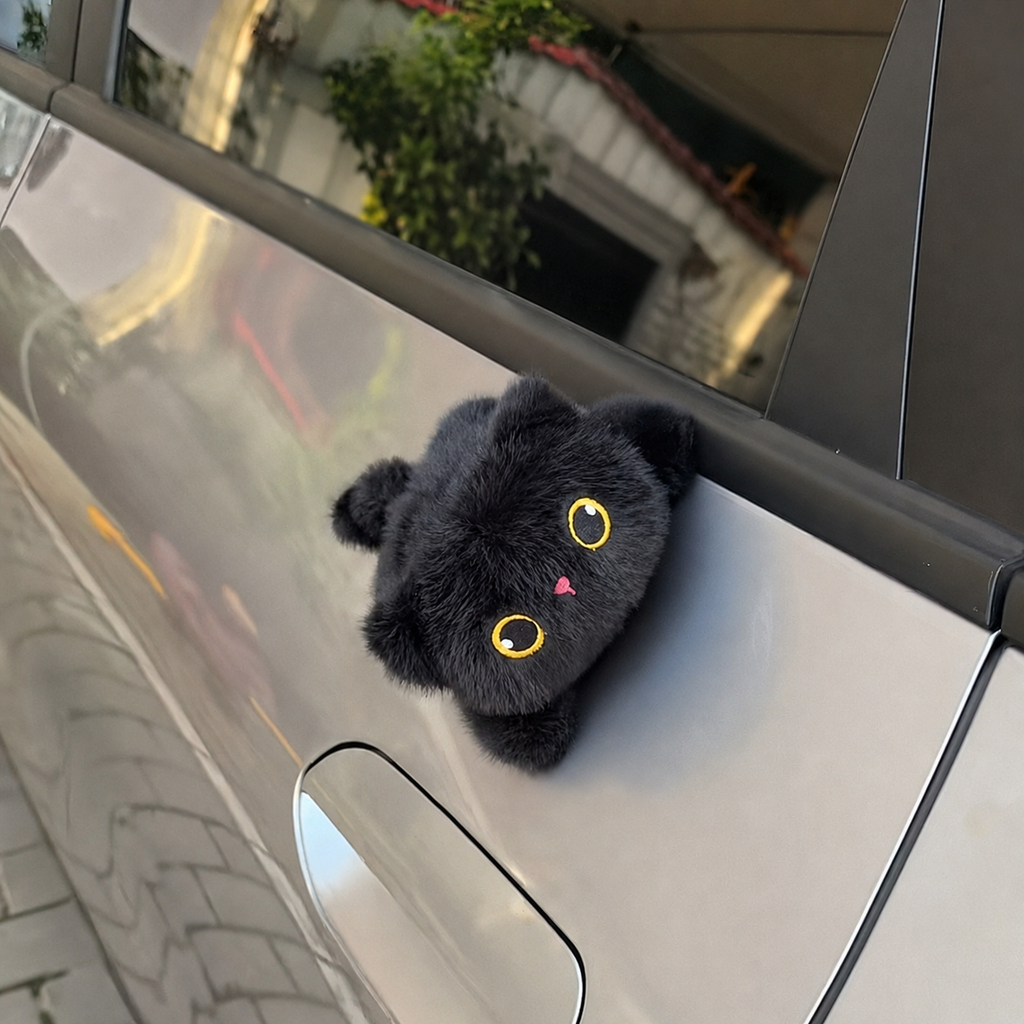 Solis Cruiser Pals — black cat magnetic plush on a silver car door