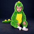 solis dino hoodie romper — Green worn by a child on a dark navy studio background