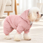 Solis Frostpaw — toy poodle in the pink padded dog winter jumpsuit with hood