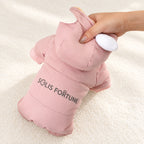 Solis Frostpaw — padded pink dog jumpsuit held up to show the thick fill