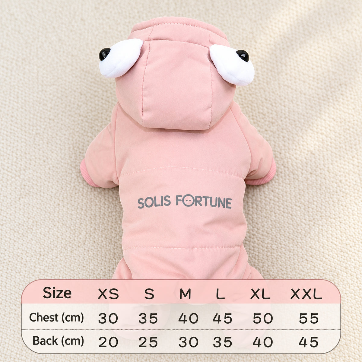 Solis Frostpaw — pink dog winter jumpsuit with cartoon-eye hood