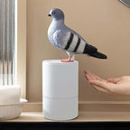 Solis — pooping pigeon soap dispenser in grey: hold your hand under the bird and foam comes out the back