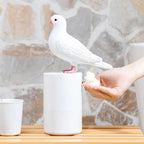 Solis — white dove automatic foam soap dispenser dispensing foam into a hand