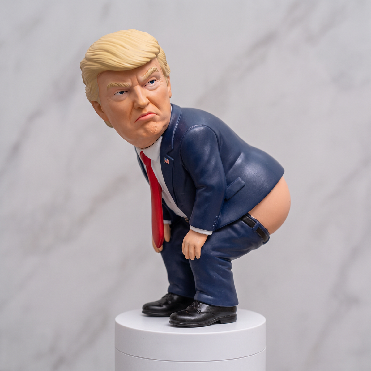 Solis — Presidential soap topper close-up in a navy suit and red tie