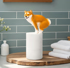 Solis — tan Shiba Inu pooping soap dispenser on a white automatic foam pump