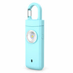 Solis Guardian — personal safety alarm in blue with carabiner clip and LED flashlight