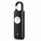 Solis Guardian — personal safety alarm in black with carabiner clip and LED flashlight