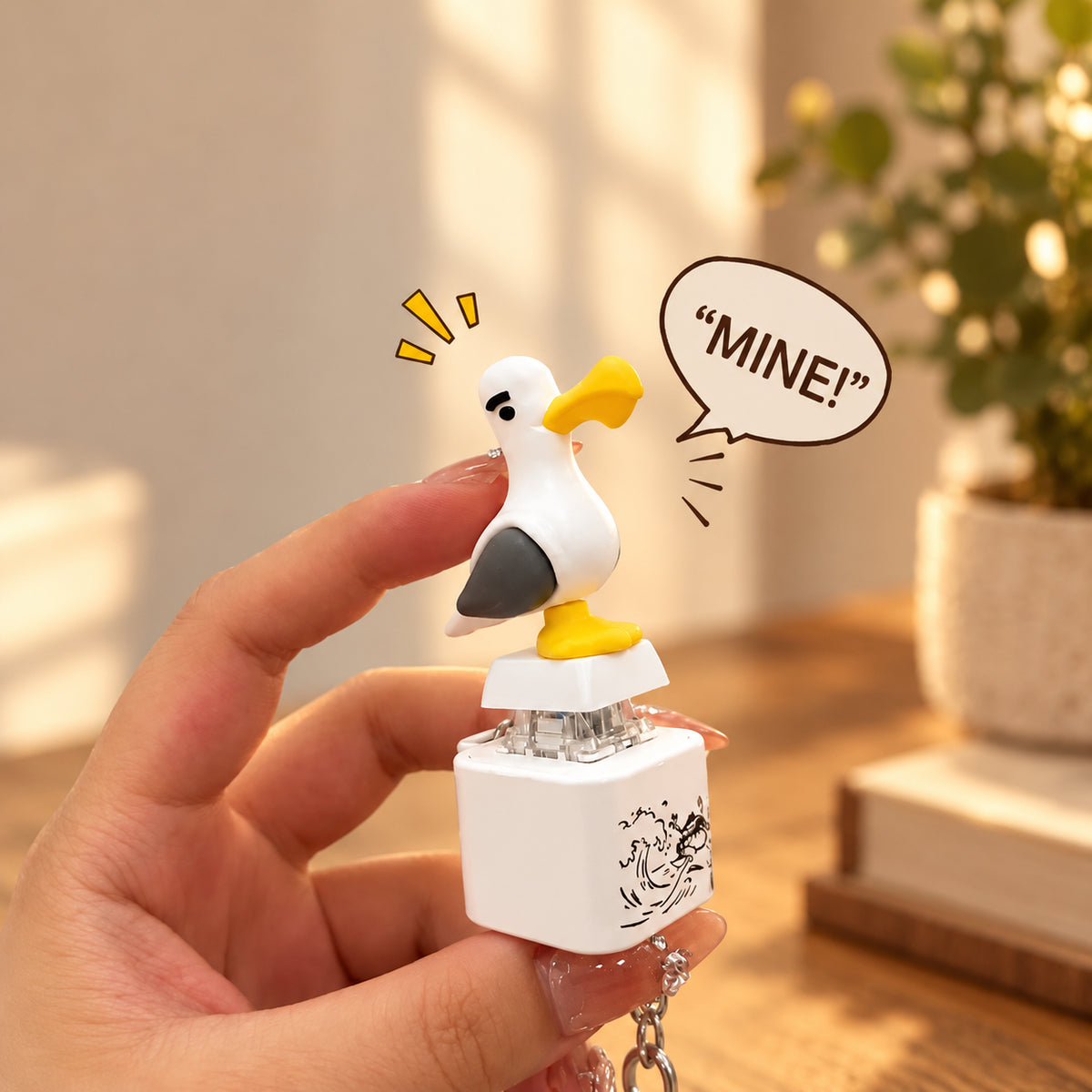 Solis Gull — seagull keychain that says mine held in a hand, shouting MINE