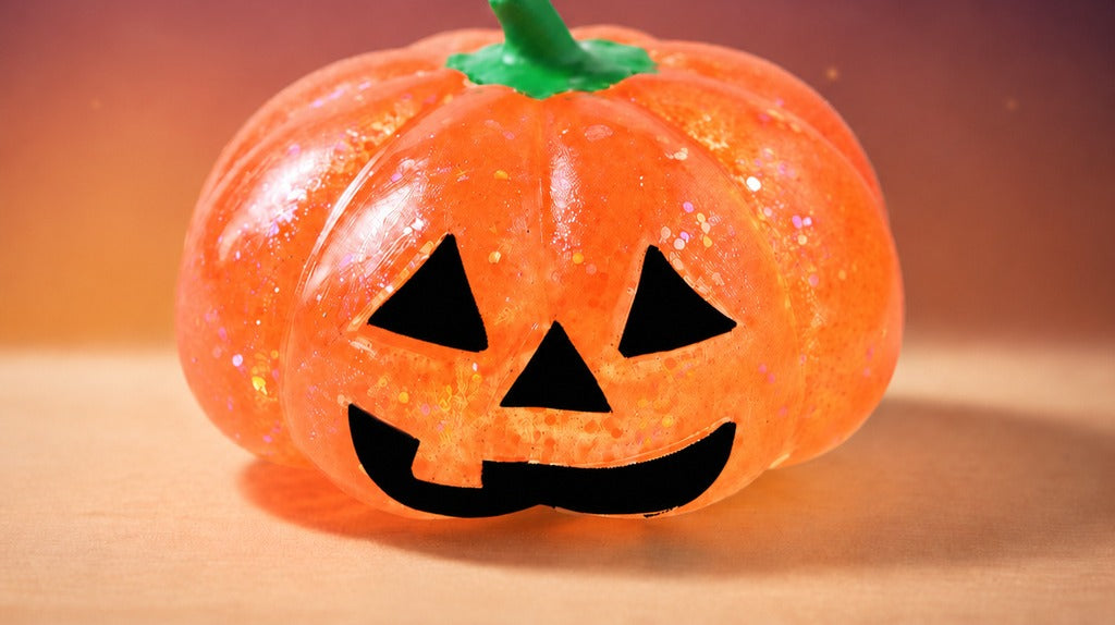 Solis Hollow — Pumpkin squishy toy in Orange glitter