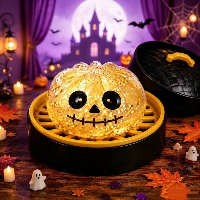 Solis Hollow — Golden Skull squishy bun, 8.5 cm, in its mini steamer
