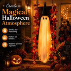Solis Hollow Swinging Ghost lighting up a Halloween porch with pumpkins